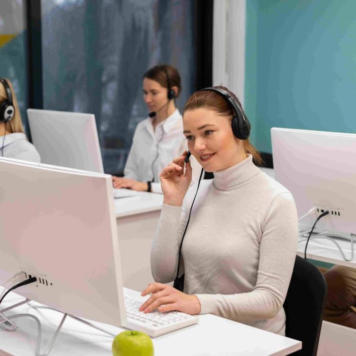 colleagues-with-headphones-working-call-center-office (1) (1) colleagues-with-headphones-working-call-center-office (1) (1)